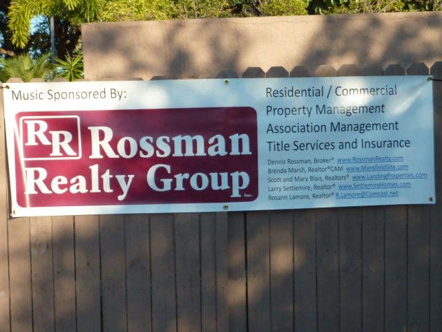 Realty group sign advertising property management services.